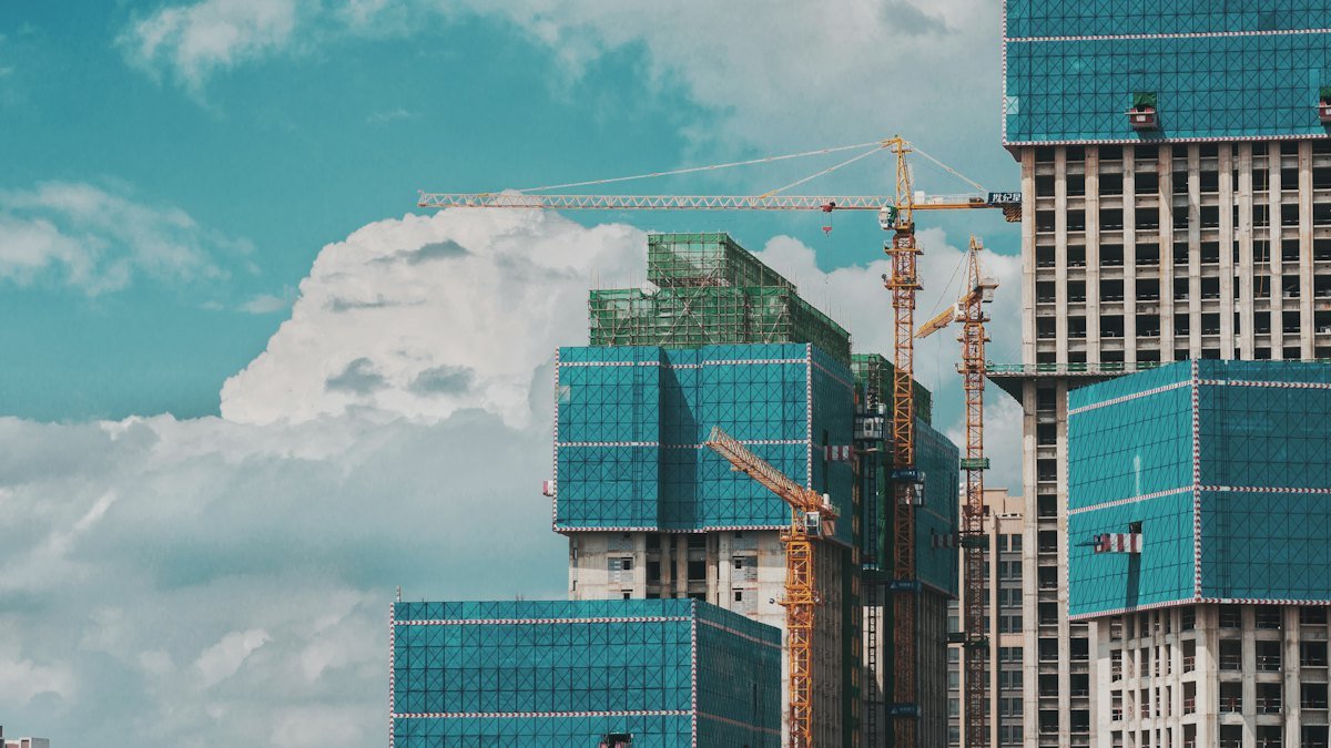 Commercial towers under construction with tower cranes