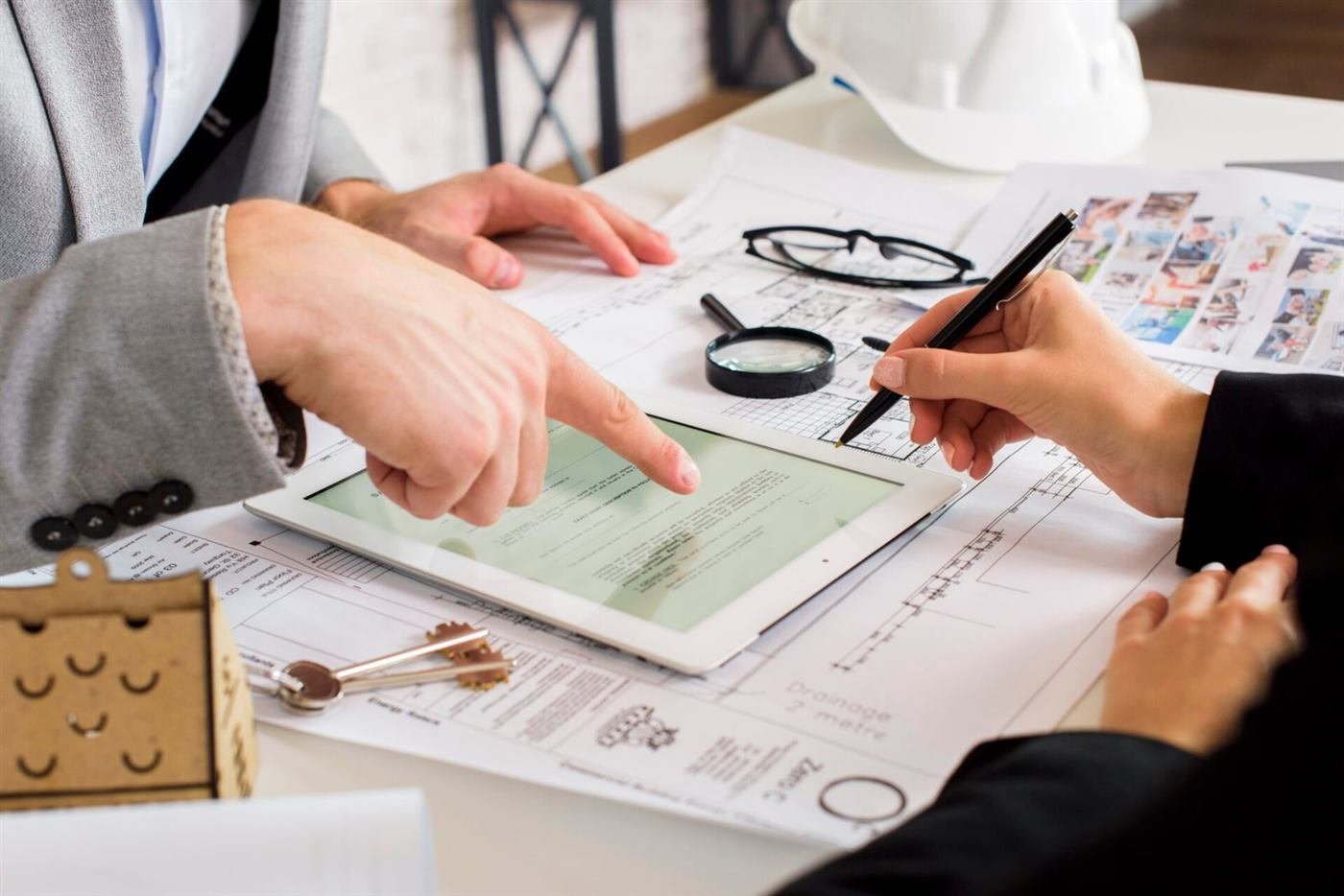 Estimators reviewing commercial construction drawings