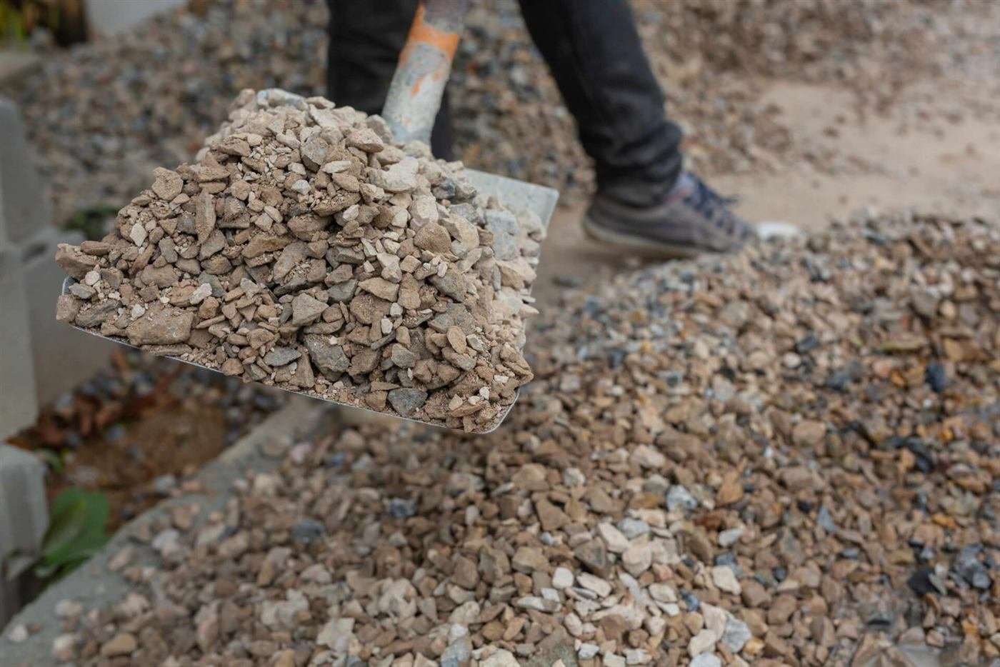 Aggregate being placed on a concrete site before a pour